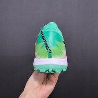 Chuteira Nike Phantom GX 2 Elite Society TF
