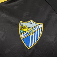 Camisa Málaga x IlloJuan 25/26 "Retrô" Especial - Torcedor