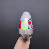 Chuteira Puma x Unisport Society Future 8 Ultimate FG Stickerbomb